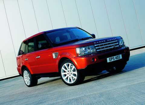 Vehicle 2008 Range Rover Red with 22 inch chrome spinner rims 